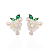A pair of silver gold plated earrings with green stones, pearls and shell flowers.